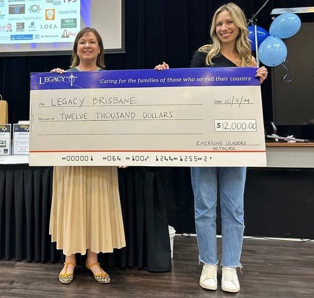 The founders presenting a cheque to Legacy Brisbane after a trivia night fundraiser